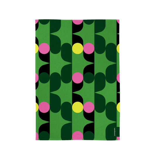Patterned tea towel with green, black, pink, and yellow colors on a white background