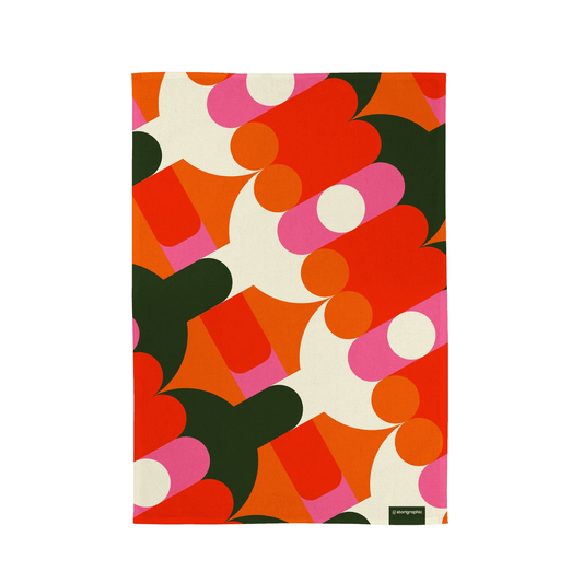 Colorful abstract patterned tea towel on a white background