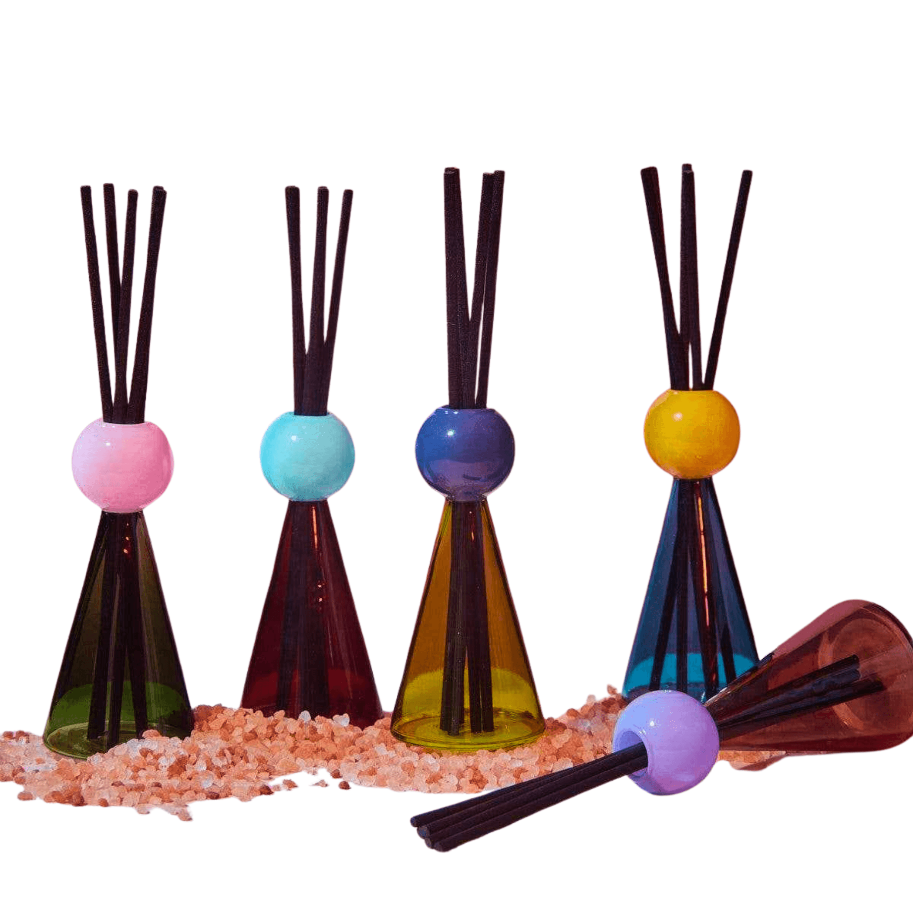 Set of four diffusers with colorful spherical ends on a white background
